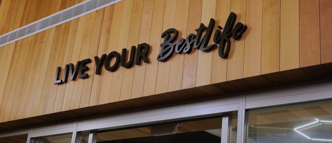 Sign at BestLife Fitness at Stephen Persinger Center that reads "Live Your BestLife"